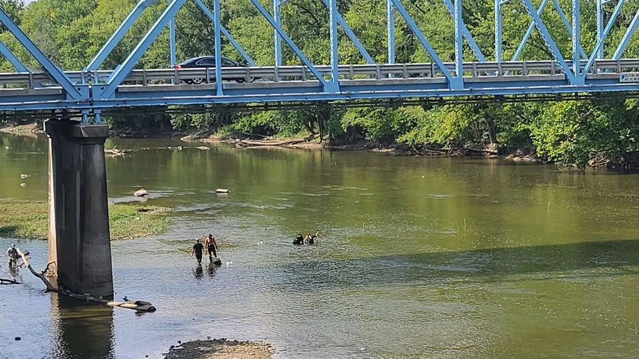 Indiana authorities research a river beneath the Kelly Avenue Bridge 