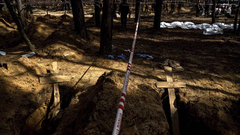 Unidentified graves of civilians and Ukrainian soldiers in a cemetery