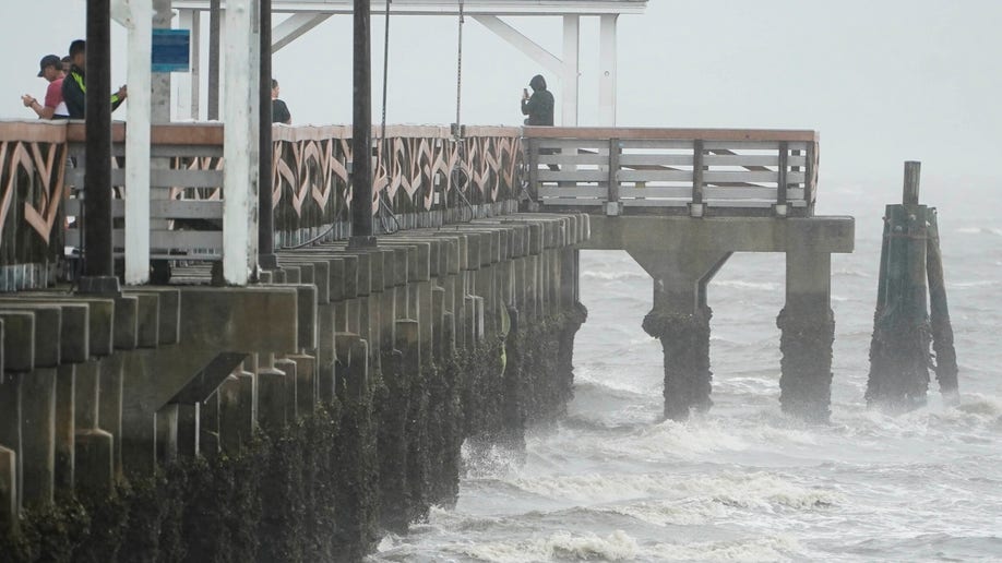 Waves crash along the Ballast Point Pier ahead of Hurricane Ian