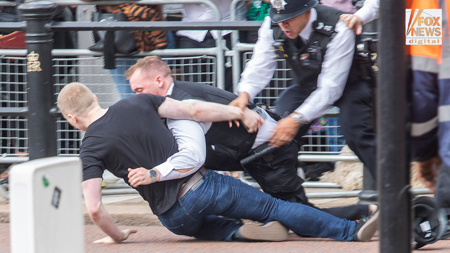 Police tackle a man