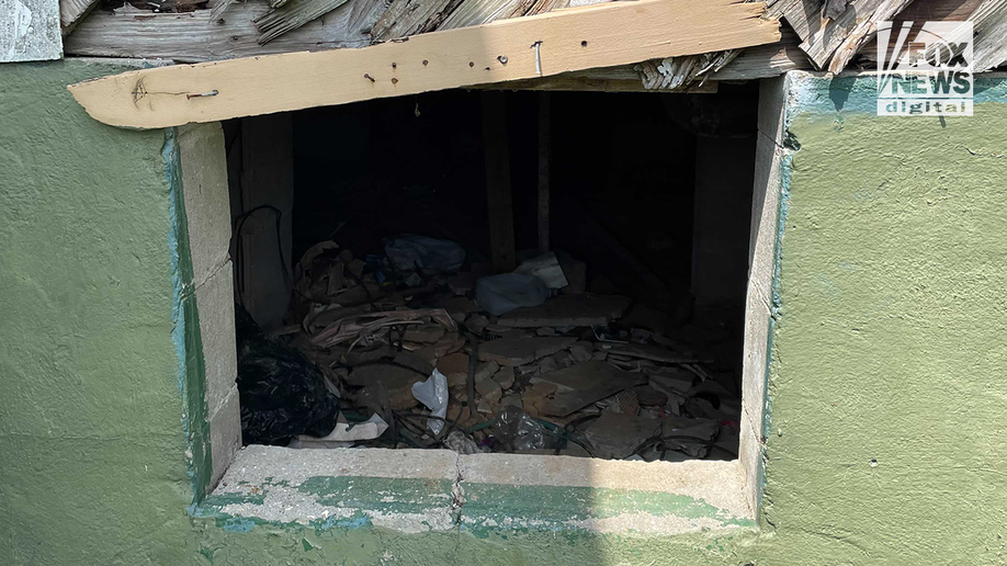 The side of crawl space of house where the body of Eliza Fletcher was found