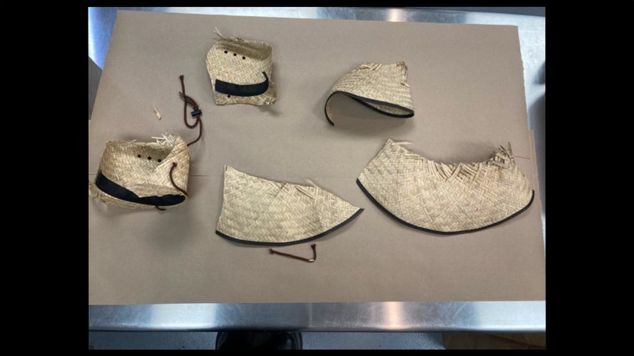 Cut-up straw hat recovered from Robert Telles' home