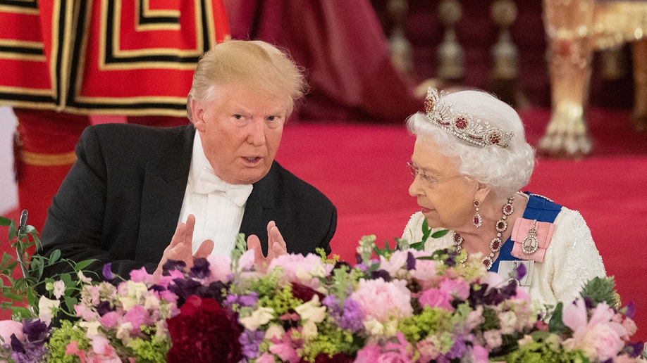 Donald Trump and Queen Elizabeth II sitting