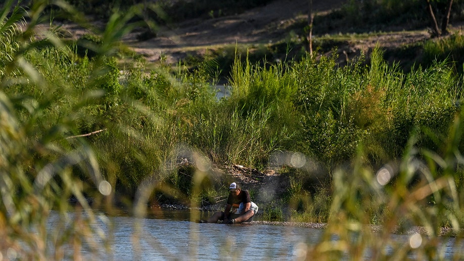 A migrant crossing the Rio Grande