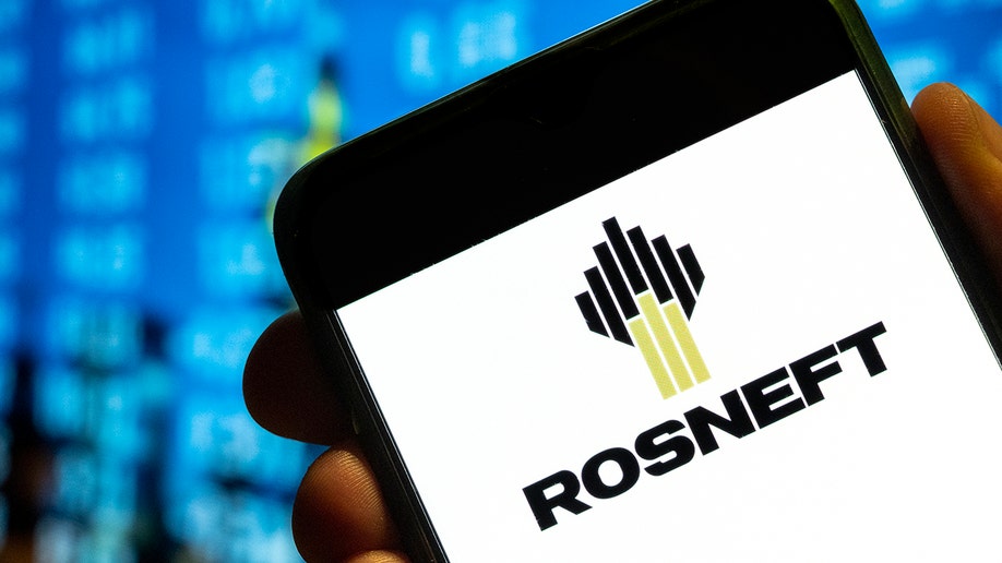 The Rosneft logo on a phone