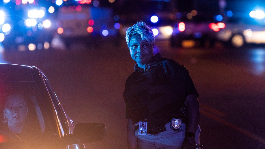 A person standing near a police car near a crime scene in Memphis