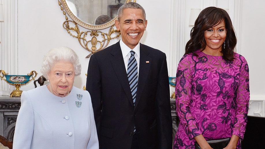 Queen Elizabeth II stands with Barack Obama and Michelle Obama