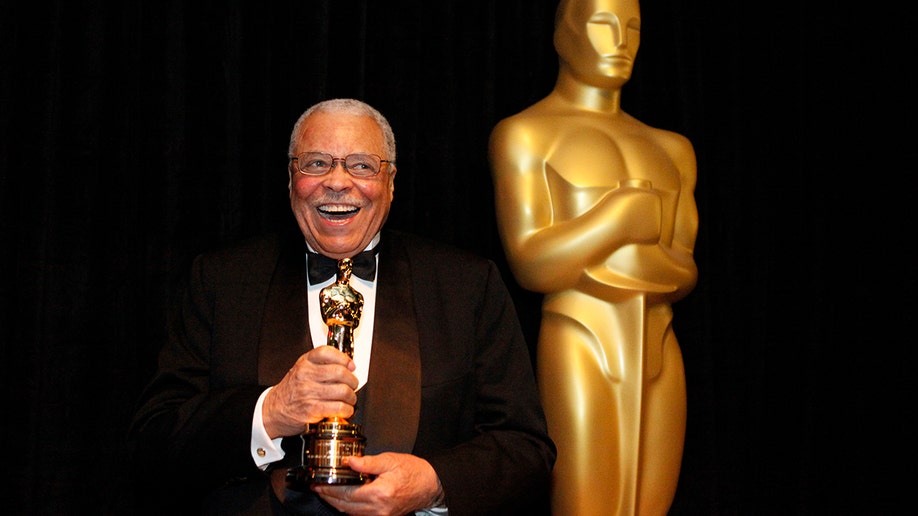 James Earl Jones holding an Oscar