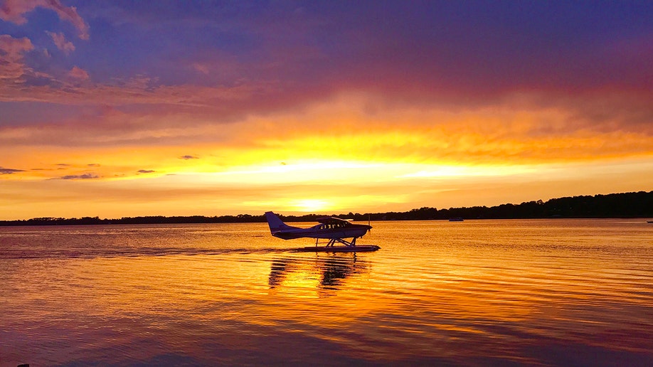 A seaplane during a sunset