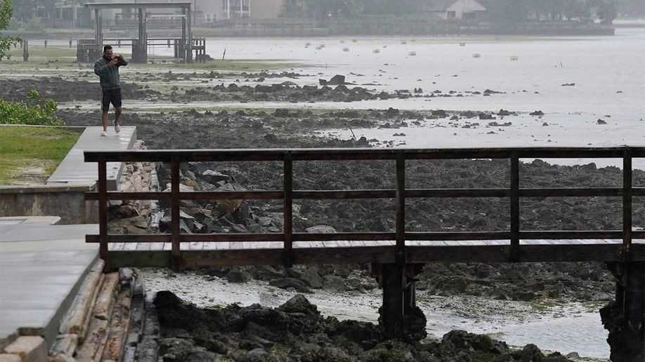 Water moves away from Tampa, Florida shore ahead of Hurricane Ian landfall