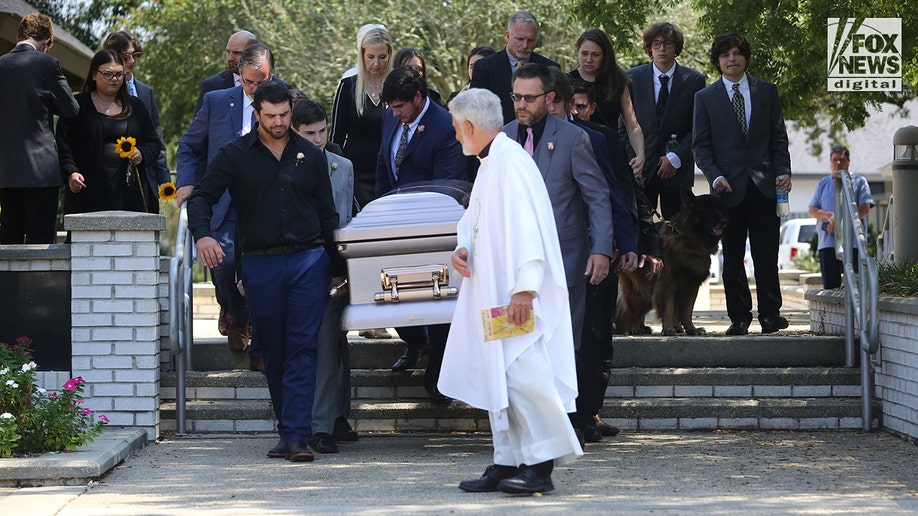 Allison Rice's casket is carried from the church to the cemetery