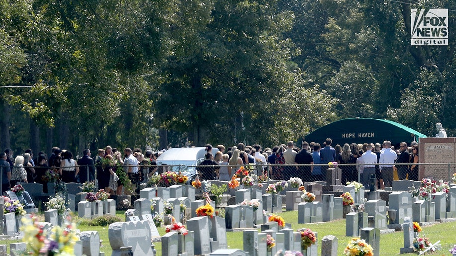 About 200 people gather for the burial of Allison Rice