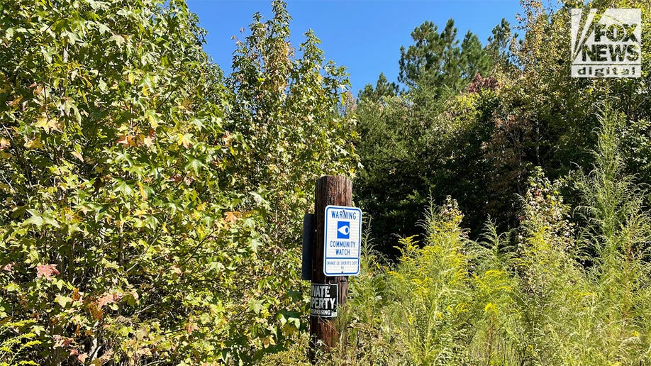 Sign near site where Clark and Woods were found dead