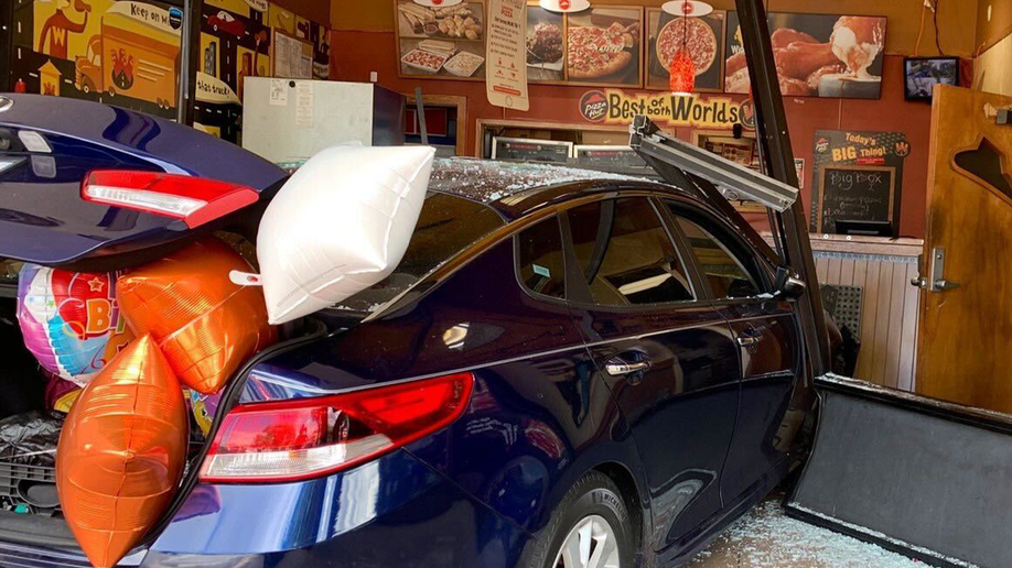 Car inside of Pizza Hut