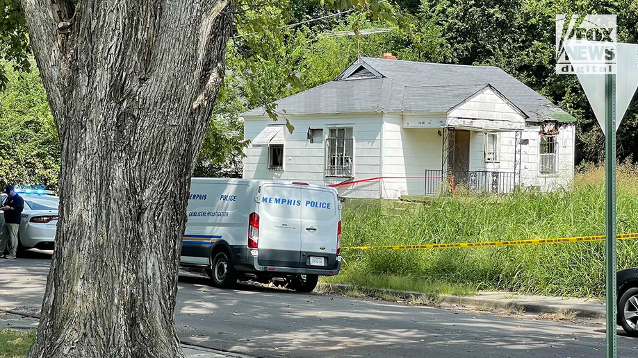 Police van and tape outside the house where the body of Eliza Fletcher was found