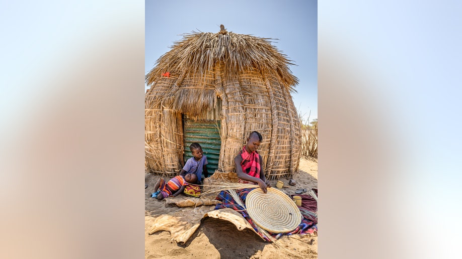 Weaving a basket in northern Kenya
