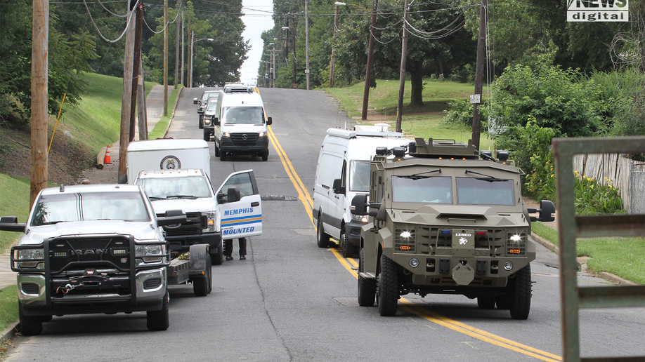 Police and army trucks outside the Command Center in the search for Eliza Fletcher