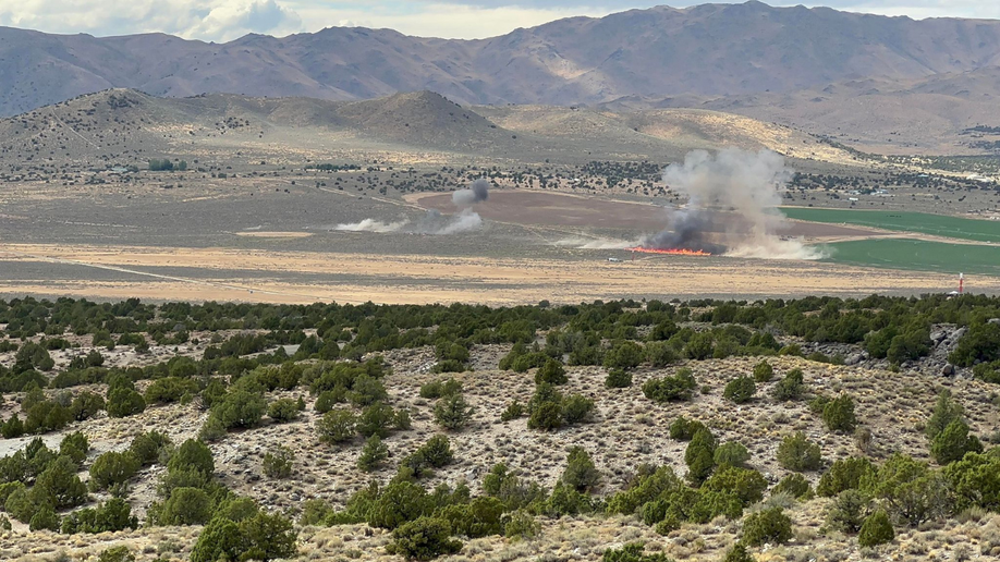 Fire and smoke can be seen where a plane went down in Reno on Sunday