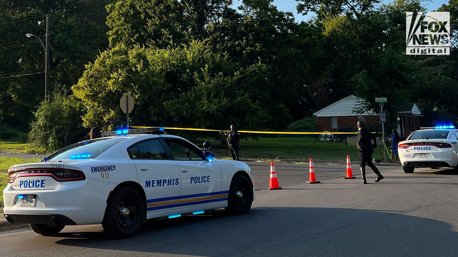 Police outside a scene marked with crime scene tape in the search for Eliza Fletcher