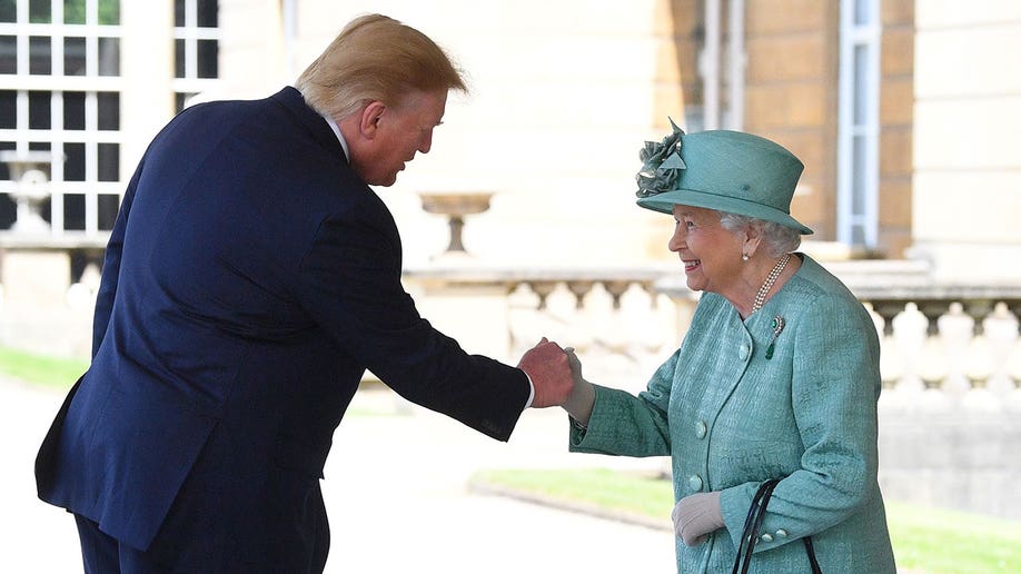 Former President Trump fistbumps Queen Elizabeth, wearing a turqouise dress and hat