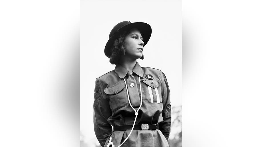 Black and white photo of teen Queen Elizabeth in military uniform