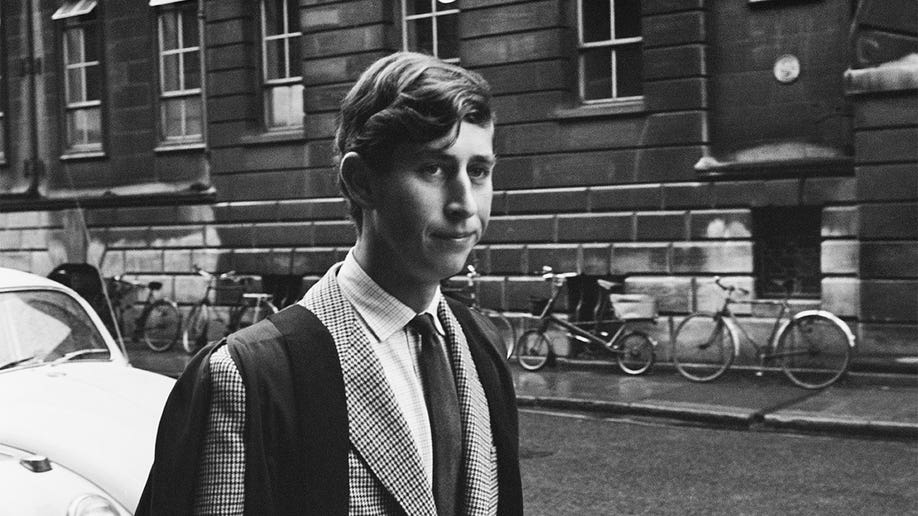 A young Prince Charles walking in Downing Street, Cambridge