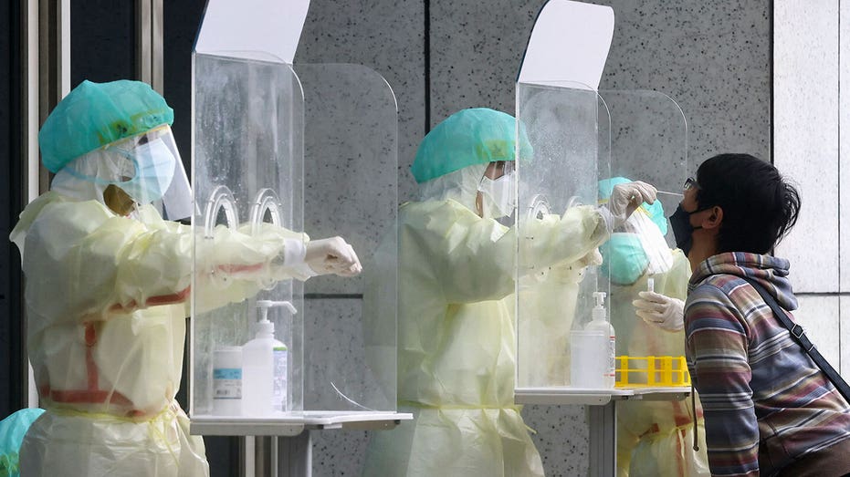 Taiwan looking to end COVID quarantine early for arrivals