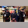 Britain's King Charles III, center, and other members of the royal family hold a vigil