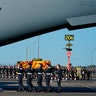 Queen Elizabeth II's coffin carried to a military plane