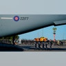 Queen Elizabeth II's coffin carried to a military plane
