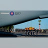 Queen Elizabeth II's coffin carried to a military plane