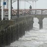 Waves crash along the Ballast Point Pier ahead of Hurricane Ian