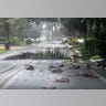 Debris is littered across a Florida street during Hurricane Ian