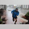 A man runs through the strets during Hurricane Ian as it hits Florida