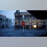 A Stop sign stands in a flooded Florida street during a gloomy afternoon as Hurricane Ian hits the state