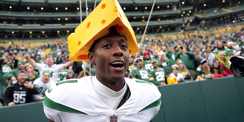 Aaron Jones of the Green Bay Packers walks through the tunnel