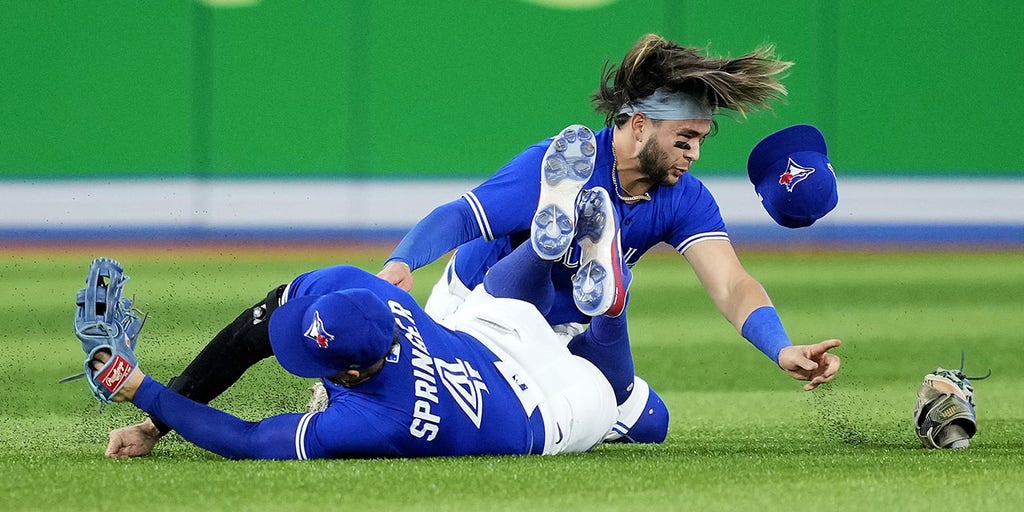 Blue Jays CF Springer carted off field after scary collision