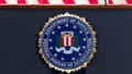 The FBI seal is displayed on a podium before a news conference at the agency's headquarters in Washington.