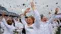Erin Finley (C) of Downingtown, Pennsylvania, and her fellow U.S. Naval Academy graduates throw their hats into the air at the conclusion of their graduation and commissioning ceremony in the academy's Memorial Stadium on May 27, 2022 in Annapolis, Maryland. President Joe Biden delivered the commencement address to the a total of 1,100 sailors and Marines who graduated from the service academy. - Fox News