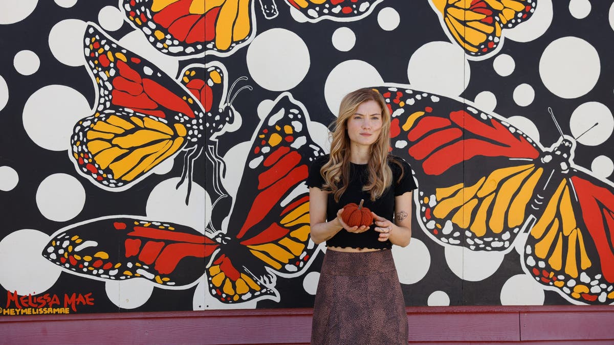 Skyler Samuels poses at Ogden, Utah, mural just as Gabby Petito did