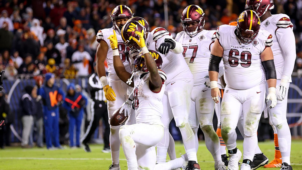 Brian Robinson celebrates touchdown