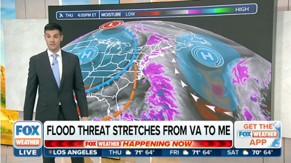 Weather reporter stands in front of weather map showing flood threat