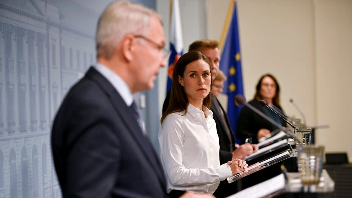 Finland's Prime Minister Sanna Marin looks at Finland's Foreign Minister Pekka Haavisto as he speaks during a press conference by the Government of Finland in Helsinki, Finland, Wednesday Sept. 28, 2022. 