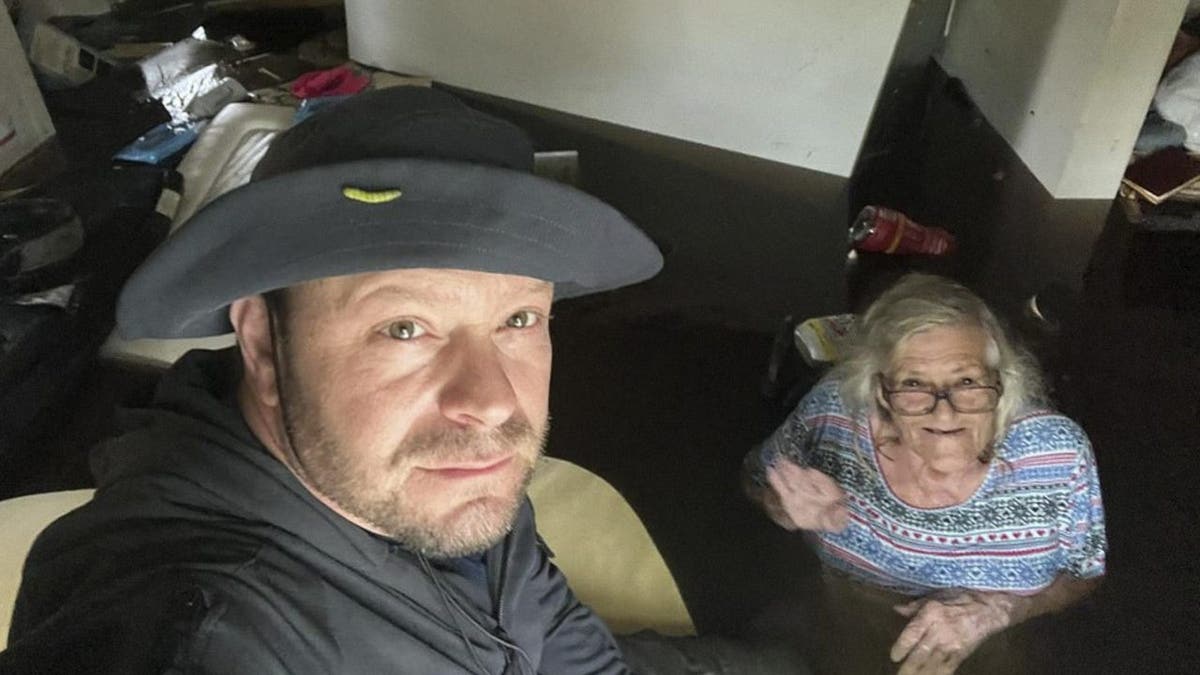 Johnny Lauder and his mom take a selfie in floodwater