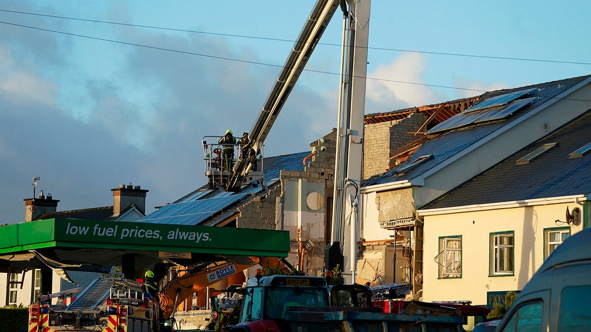 A photo of work crews digging through rubble in Ireland