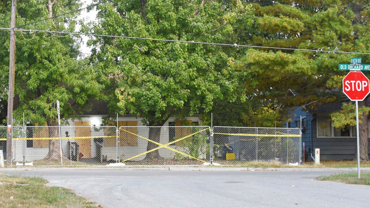 Timothy Haslett's small home boarded up, taped off