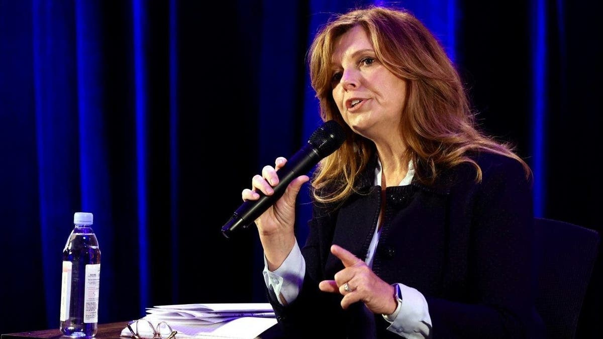 Christine Drazan speaks into microphone while sitting on stage