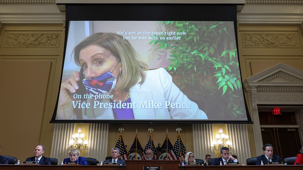 A projector screen featuring Nancy Pelosi