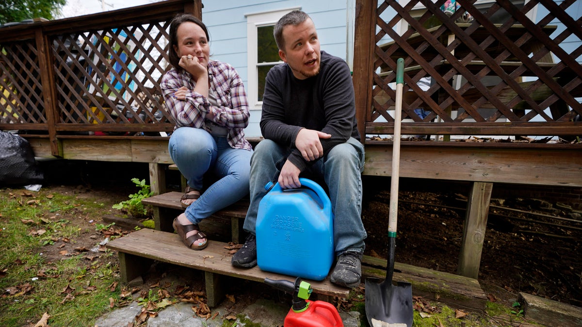 Man and woman with gas canisters