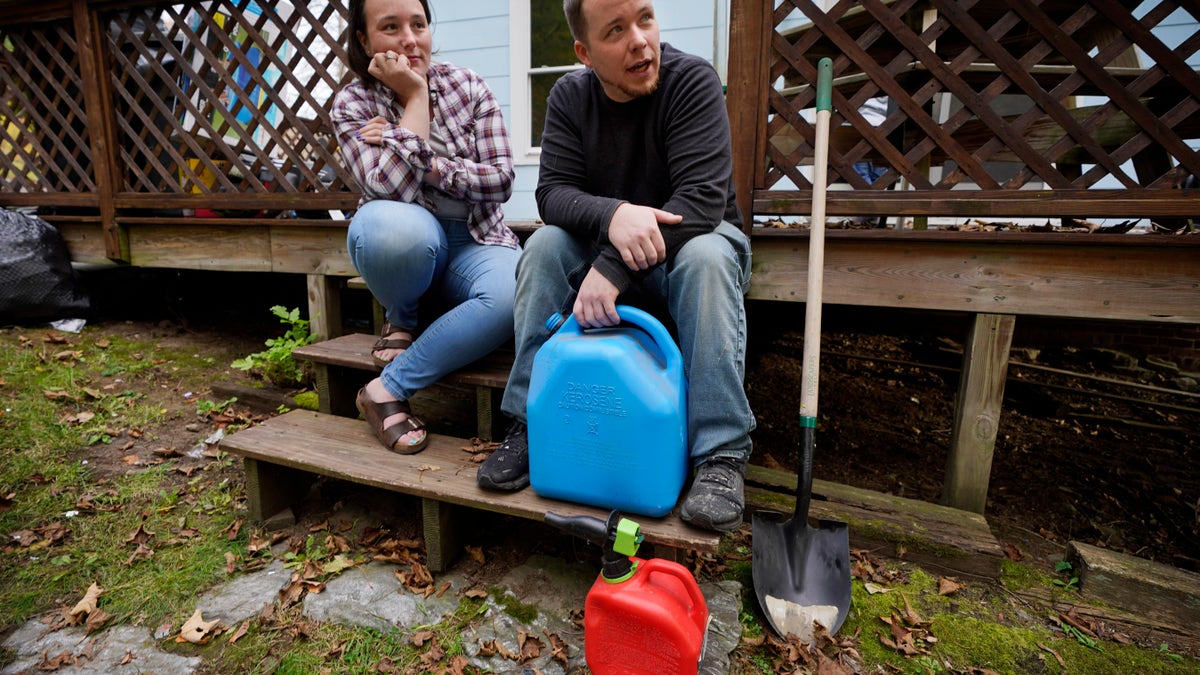 Man and woman with gas canisters